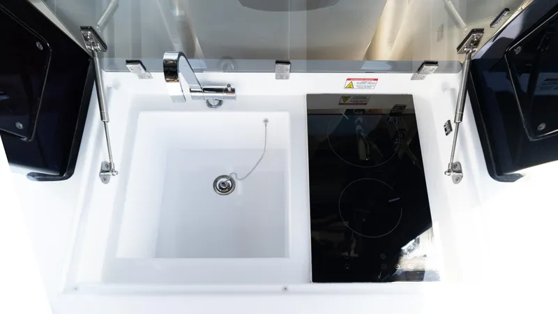 Slide: The Image of Modern kitchen area on 2025 Pardo Yachts 38 with sink and stovetop. - 18