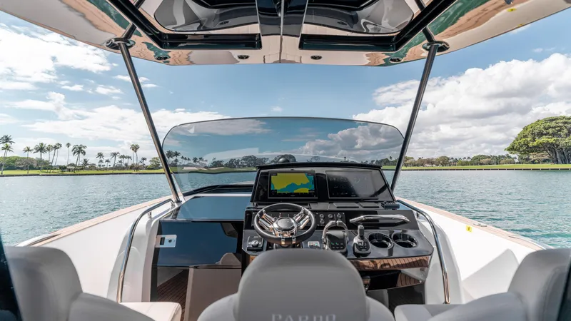 Slide: The Image of 2025 Pardo Yachts 38 cockpit with modern navigation system, steering wheel, and scenic water view. - 20