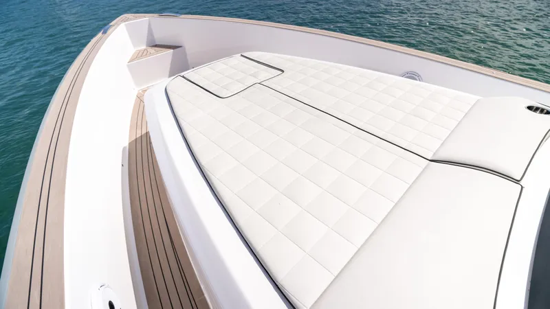Slide: The Image of 2025 Pardo Yachts 38 with spacious sunbathing deck on calm waters. - 29
