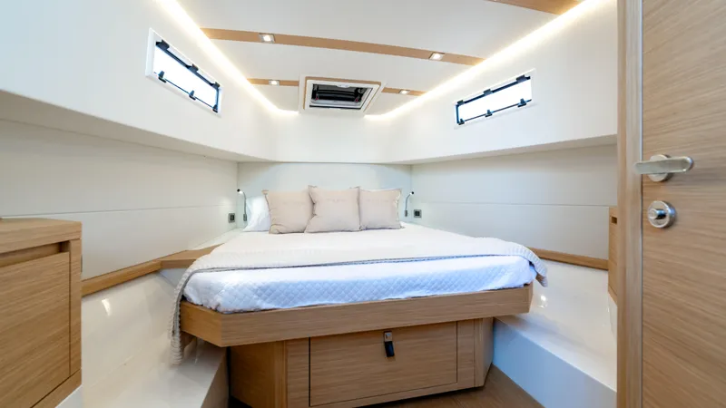 Slide: The Image of Luxurious cabin interior of 2025 Pardo Yachts 38 with modern design and cozy bedding. - 31