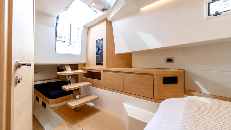 Slide: The Image of Luxurious interior of 2025 Pardo Yachts 38, featuring modern wood finishes and ample natural light. - 32