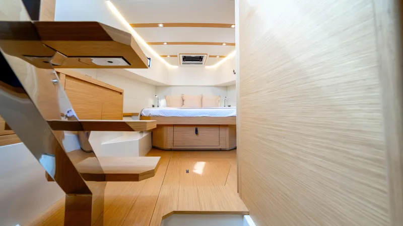 Slide: The Image of Interior of 2025 Pardo Yachts 38, featuring modern wooden design and cozy sleeping area. - 36