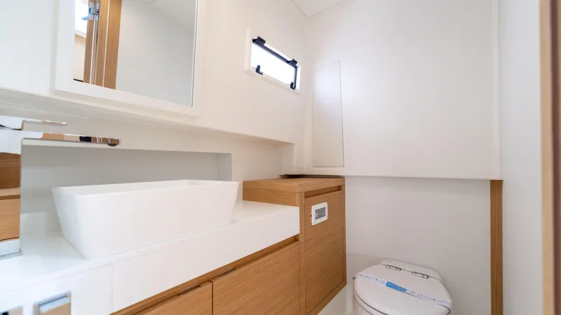 Slide: The Image of Modern bathroom interior on 2025 Pardo Yachts 38, featuring sleek sink and wooden cabinetry. - 38