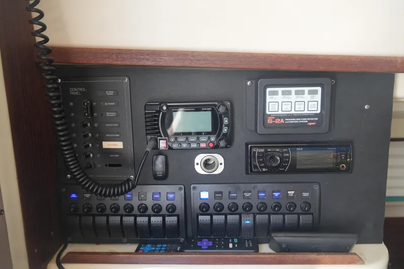 Slide: The Image of Control panel of a 1997 Gemini 105M boat with various electronic devices. - 16