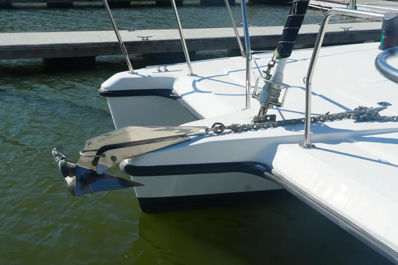 Slide: The Image of Bow of 1997 Gemini 105M catamaran with anchor and chain in marina. - 6