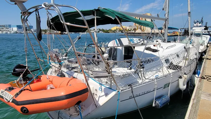 Slide: The Image of 2002 Beneteau Oceanis Clipper 361 sailboat docked with lifeboat attached. - 1