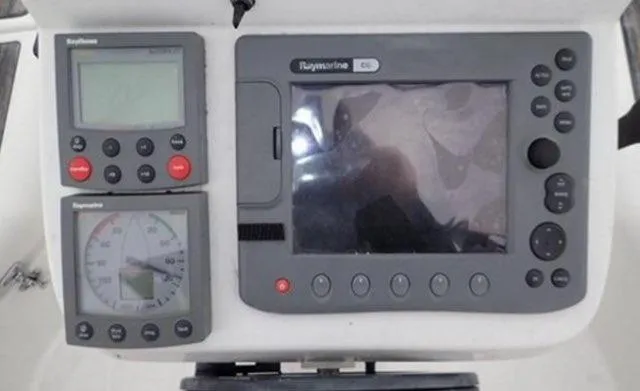 Slide: The Image of Navigation instruments on a 2002 Beneteau Oceanis Clipper 361 yacht dashboard. - 11