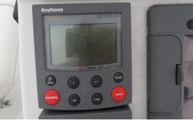 Slide: The Image of Raytheon autopilot control panel on 2002 Beneteau Oceanis Clipper 361 sailboat. - 13