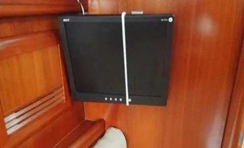 Slide: The Image of Wall-mounted monitor inside 2002 Beneteau Oceanis Clipper 361 yacht cabin. - 16
