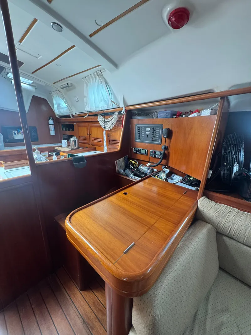 Slide: The Image of Interior of 2002 Beneteau Oceanis Clipper 361 sailboat with wooden navigation station. - 32