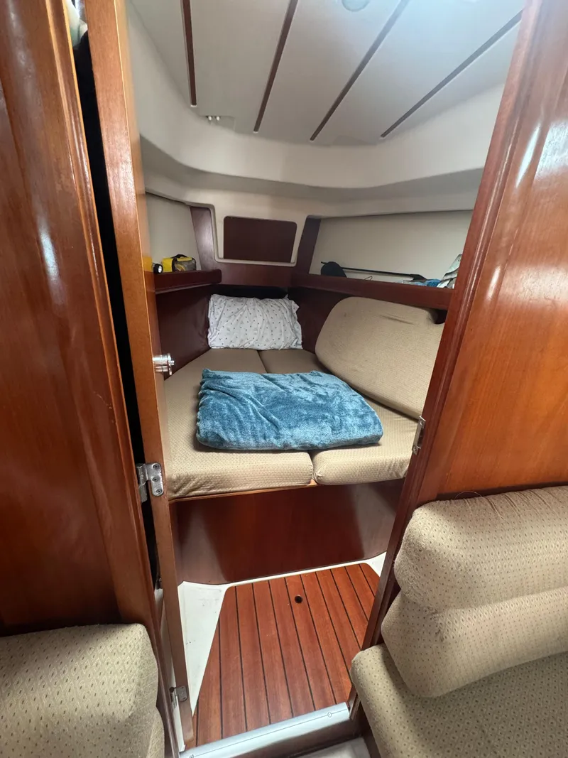 Slide: The Image of Cozy cabin interior of 2002 Beneteau Oceanis Clipper 361 sailboat with wooden finish. - 33