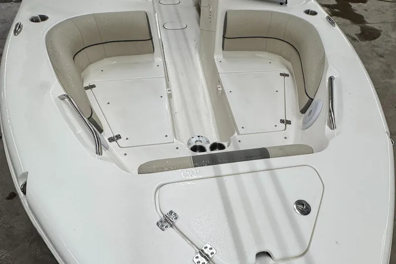 Slide: The Image of 2025 Key West 203DFS boat interior with spacious seating and storage compartments. - 4
