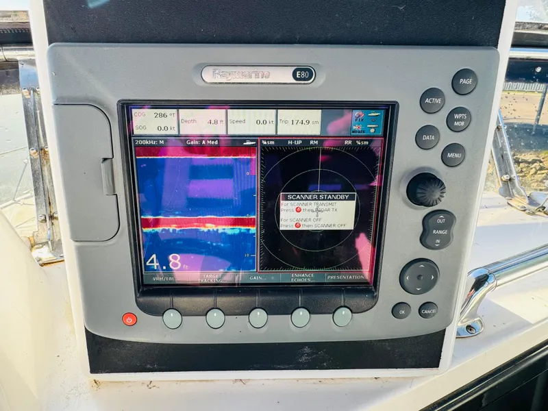 Slide: The Image of Navigation system on 1991 Ocean Alexander 440 Sundeck CPMY boat, displaying radar and sonar data. - 32
