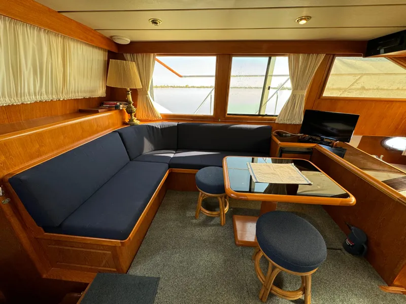 Slide: The Image of 1991 Ocean Alexander 440 Sundeck CPMY interior with cozy seating and elegant wood finish. - 38