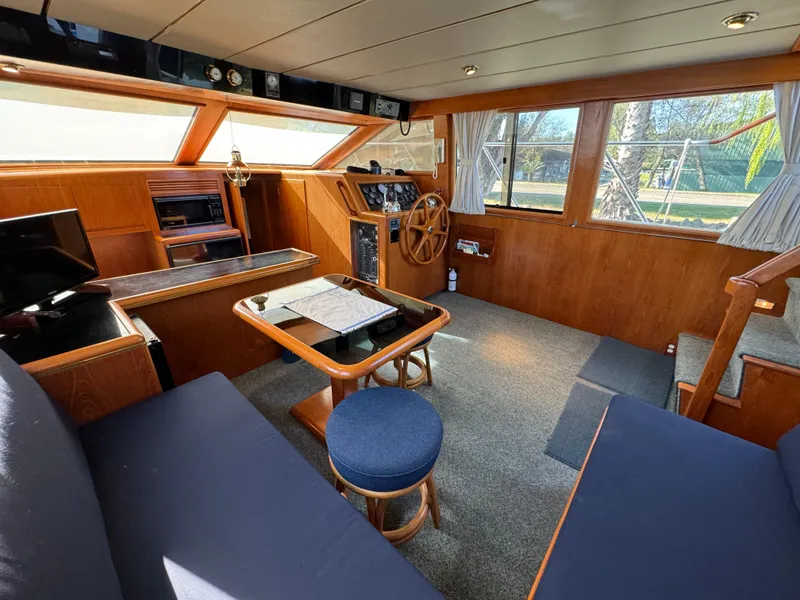 Slide: The Image of Interior of 1991 Ocean Alexander 440 Sundeck CPMY with wood paneling and seating area. - 39