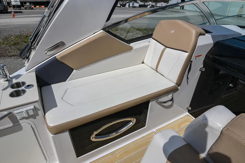 Slide: The Image of 2014 Four Winns V275 boat interior with beige and white seating. - 19