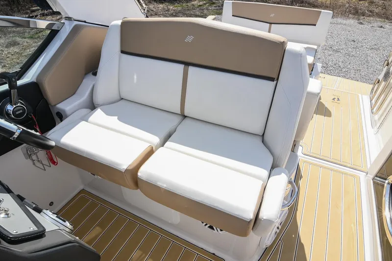 Slide: The Image of 2014 Four Winns V275 boat interior with beige and white seating. - 28