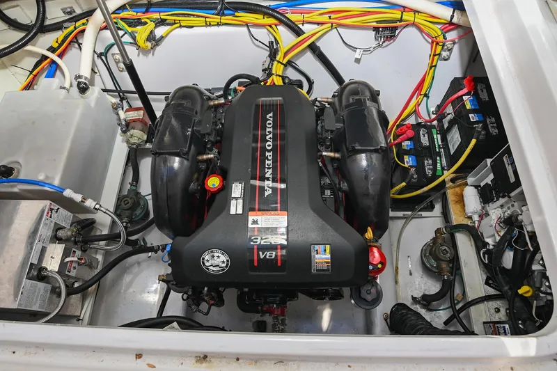 Slide: The Image of 2014 Four Winns V275 engine compartment with Volvo Penta V8 engine and wiring. - 32