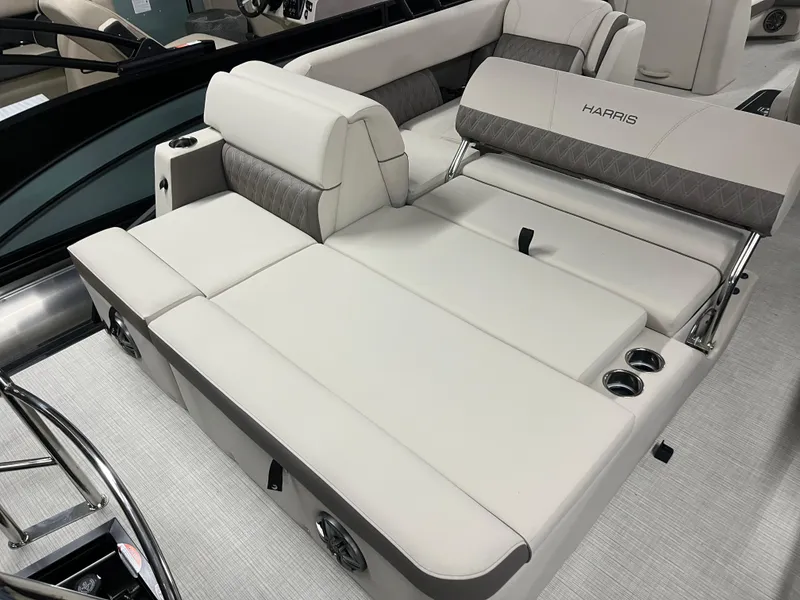 Slide: The Image of 2025 Harris Sunliner 230 boat interior with luxurious seating and cup holders. - 5