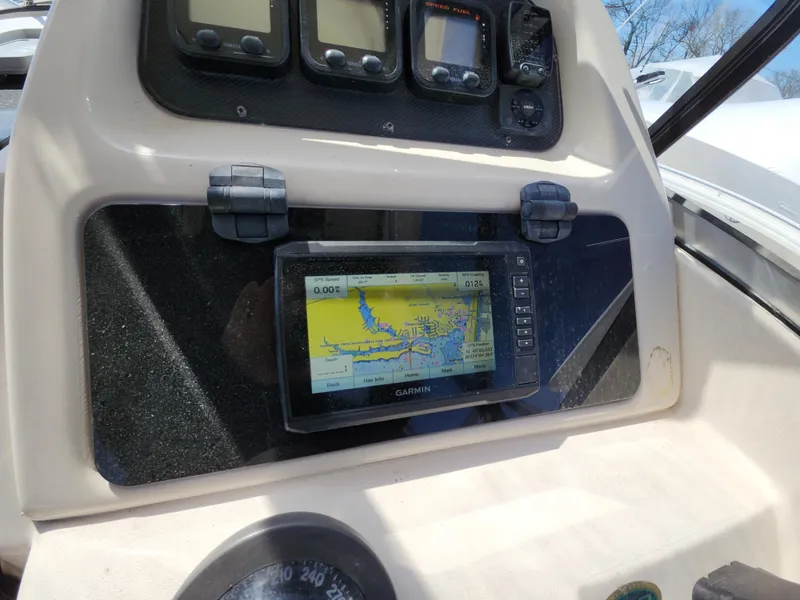 Slide: The Image of 2006 Grady-White Journey 258 boat dashboard with Garmin GPS navigation system. - 16