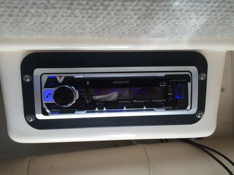 Slide: The Image of Kenwood stereo system in 2006 Grady-White Journey 258 boat dashboard. - 21