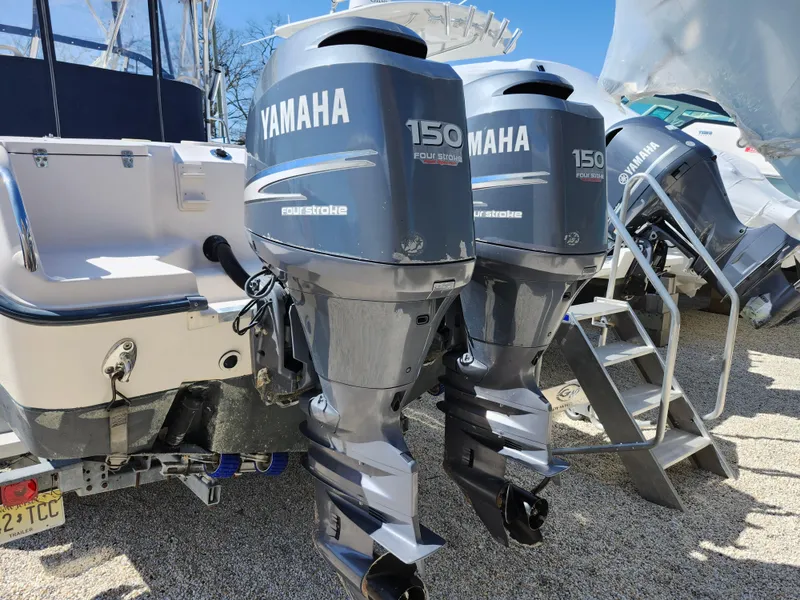 Slide: The Image of Twin Yamaha 150 outboard engines on a 2006 Grady-White Journey 258 boat. - 31