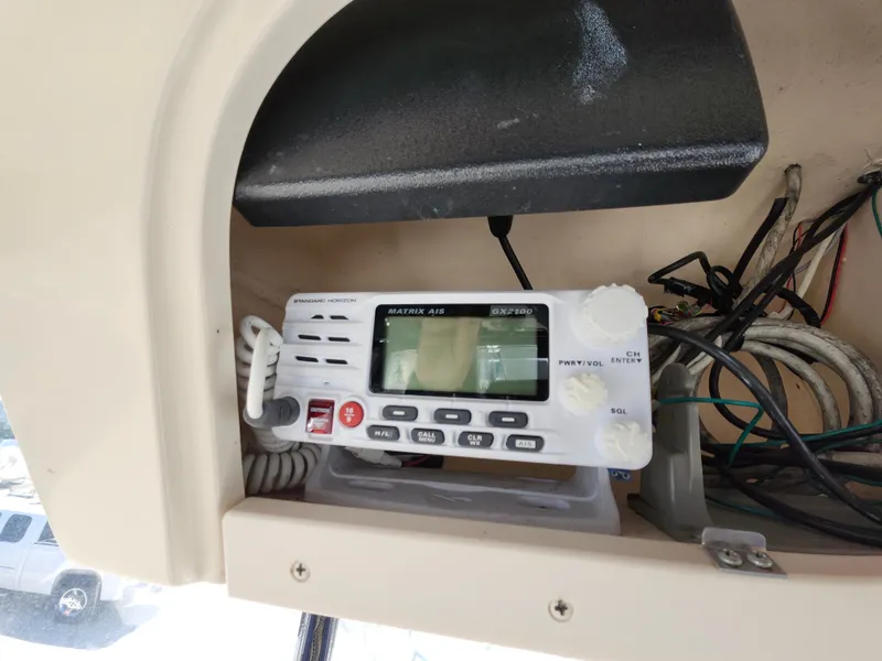 Slide: The Image of VHF radio installed on 2006 Grady-White Journey 258 boat dashboard. - 37