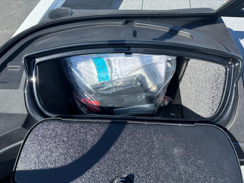 Slide: The Image of Storage compartment of 2025 Crestliner 1750 Hawk boat, containing various items. - 12