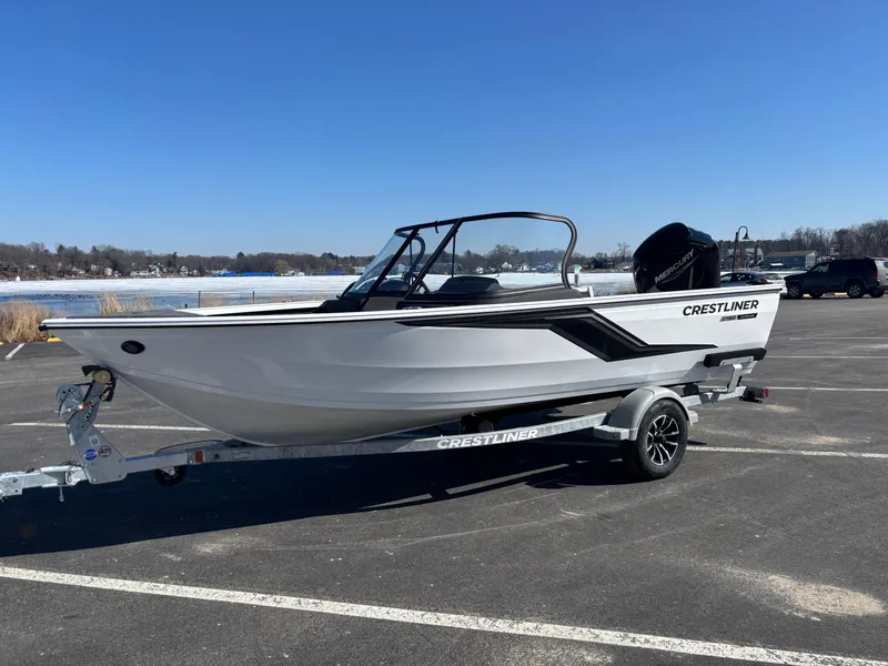 Slide: The Image of 2025 Crestliner 1750 Hawk boat on trailer in parking lot, sunny day. - 4