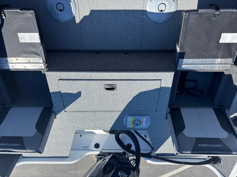 Slide: The Image of 2025 Crestliner 1750 Hawk boat interior with storage compartments and seating. - 8