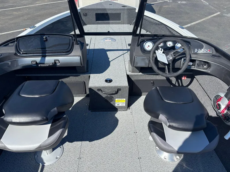 Slide: The Image of Interior view of 2025 Crestliner 1750 Hawk boat with dual seats and steering console. - 9