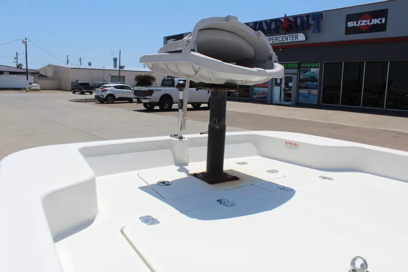 Slide: The Image of 2019 Mako Pro Skiff 15 CC boat deck with seat, parked near dealership. - 10
