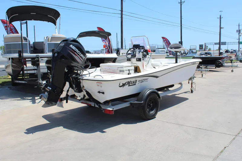 Slide: The Image of 2019 Mako Pro Skiff 15 CC boat with Mercury outboard motor on trailer. - 5