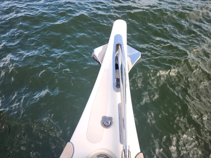 Slide: The Image of Bow of 2023 Hallberg-Rassy 57 yacht on water. - 14