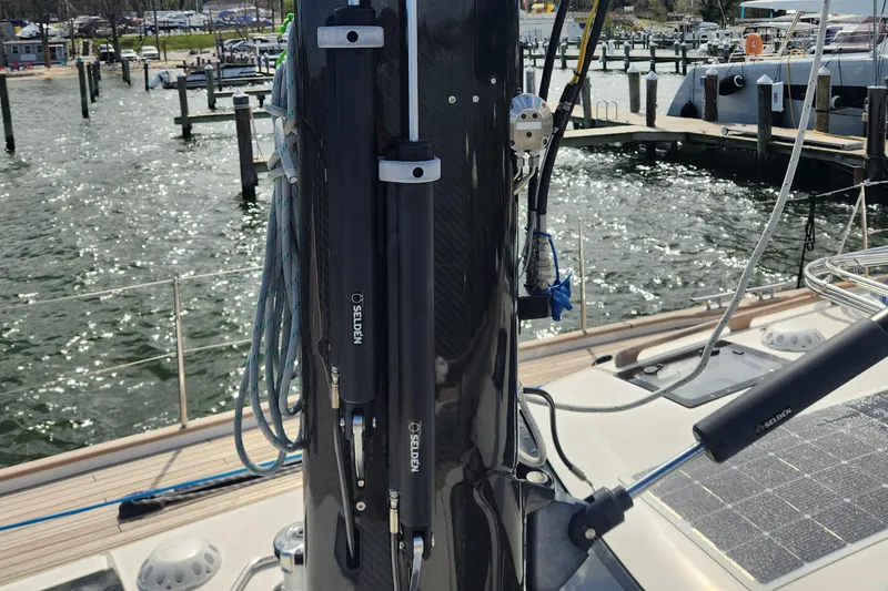 Slide: The Image of 2023 Hallberg-Rassy 57 yacht deck with mast and rigging details. - 30