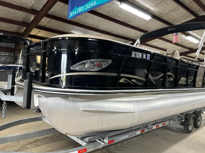 Slide: The Image of 2017 Bentley Pontoons 220 Elite Admiral on trailer in indoor storage. - 12
