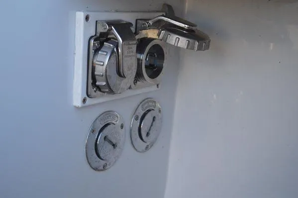 Slide: The Image of Fuel and water caps on a 1990 Stanley 36' Downeast Fly Bridge Cruise boat. - 15