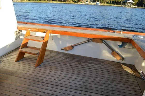 Slide: The Image of Stanley 36' Downeast Fly Bridge Cruise, 1990, wooden deck, scenic water view. - 16