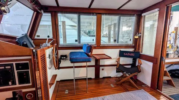Slide: The Image of Interior of a 1990 Stanley 36' Downeast Fly Bridge Cruise with wooden accents and seating. - 34