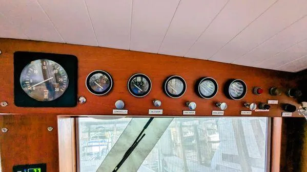 Slide: The Image of Control panel of a 1990 Stanley 36' Downeast Fly Bridge Cruise boat. - 36