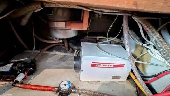 Slide: The Image of Engine room of 1990 Stanley 36' Downeast Fly Bridge Cruise with Sea Frost refrigeration unit. - 43