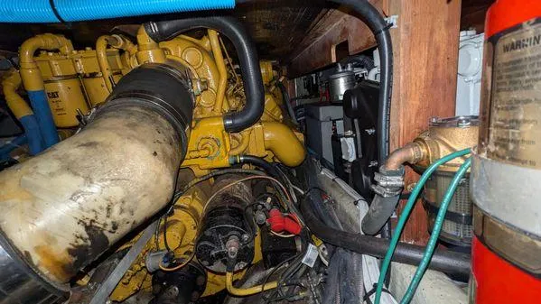 Slide: The Image of Engine room of 1990 Stanley 36' Downeast Fly Bridge Cruise boat, showing machinery and components. - 47
