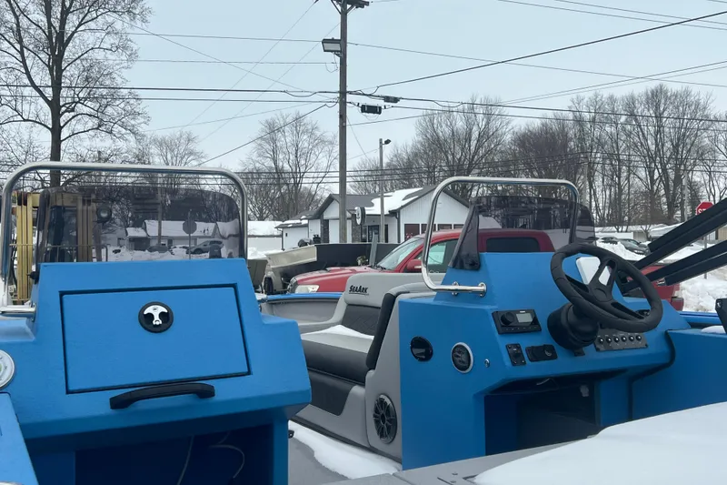 Slide: The Image of 2026 SeaArk Easy 200 boat interior with blue dashboard and steering wheel. - 15