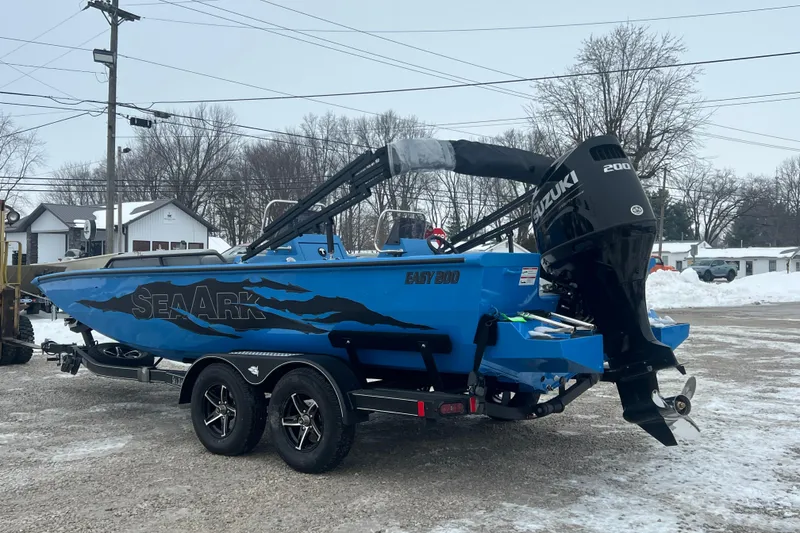 Slide: The Image of 2026 SeaArk Easy 200 boat with Suzuki engine on a snowy day. - 18