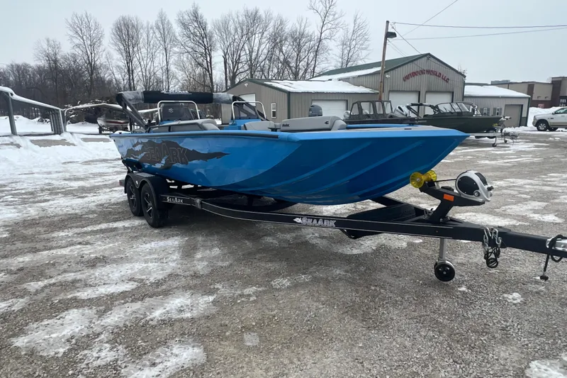 Slide: The Image of 2026 SeaArk Easy 200 boat on trailer in snowy outdoor setting. - 21