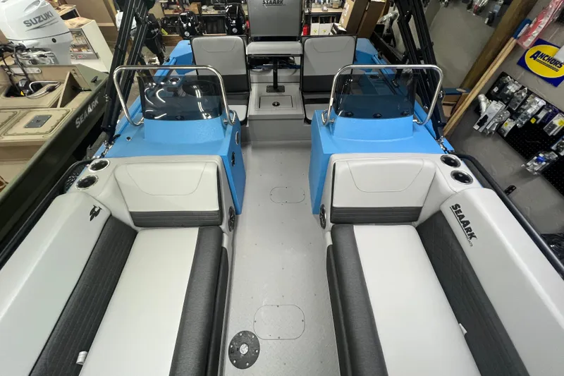 Slide: The Image of 2026 SeaArk Easy 200 boat interior with blue accents and seating arrangement. - 23