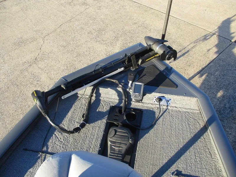 Slide: The Image of 2017 Tracker Pro Team™ 195 TXW boat deck with trolling motor and control panel. - 4