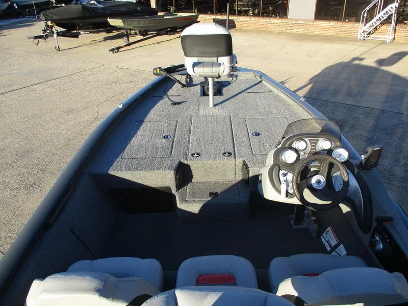 Slide: The Image of 2017 Tracker Pro Team™ 195 TXW fishing boat interior with steering console and seating. - 6
