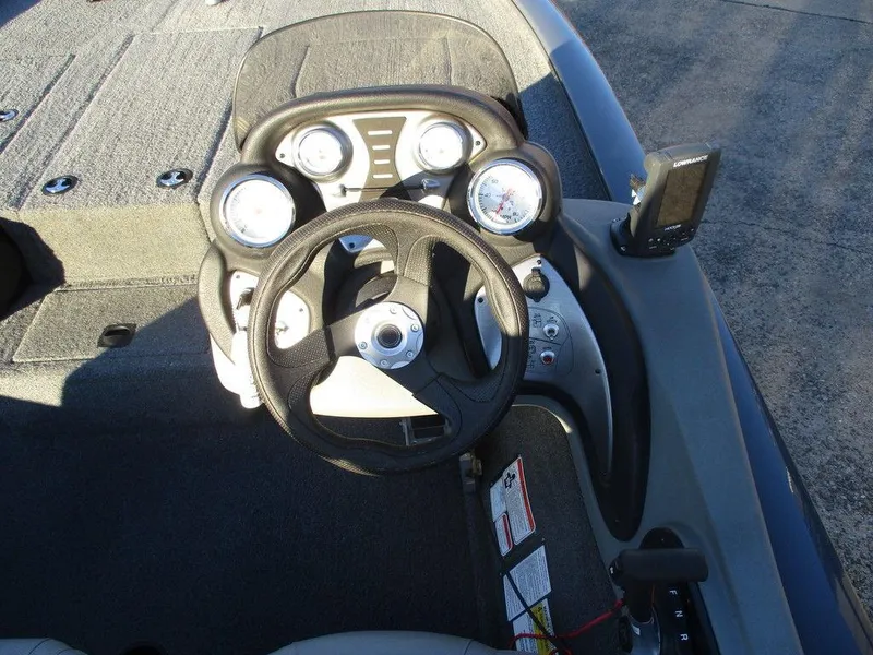 Slide: The Image of 2017 Tracker Pro Team™ 195 TXW boat dashboard with steering wheel and gauges. - 7