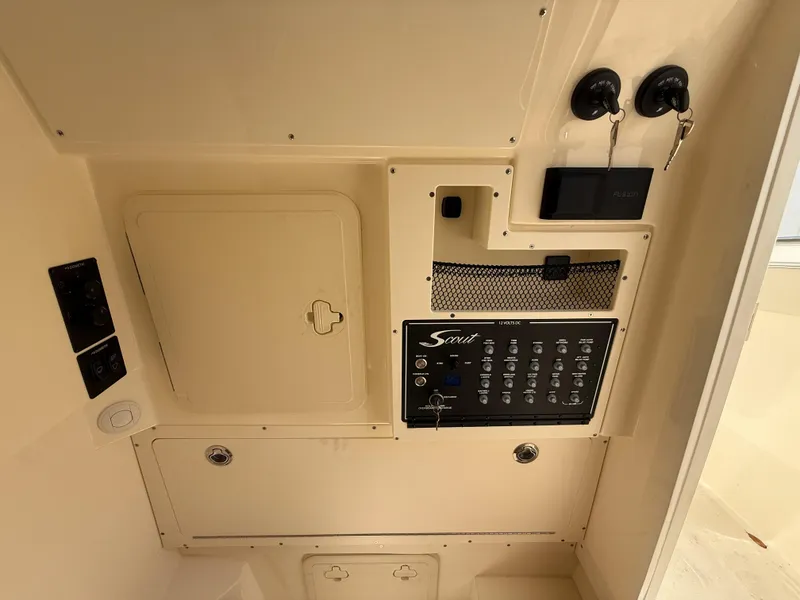 Slide: The Image of Control panel of 2025 Scout 305 LXF boat interior. - 23